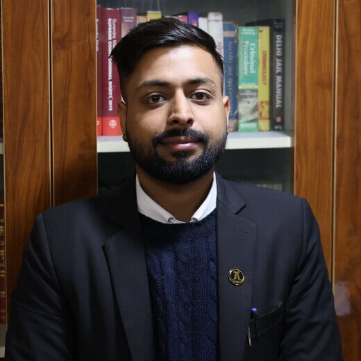 Advocate Rohan Mittal in lawyer dress standing in office