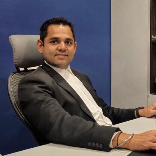 Advocate Sahil Shah in lawyer dress sitting in office