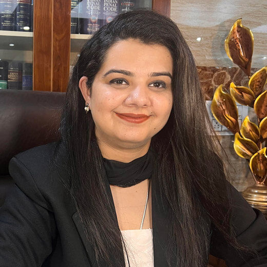 Advocate Anjali S. Chowdhry seated in office in lawyer gown