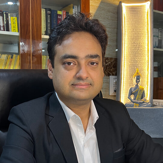 Advocate Shashank S. Chowdhry in legal attire seated at office desk