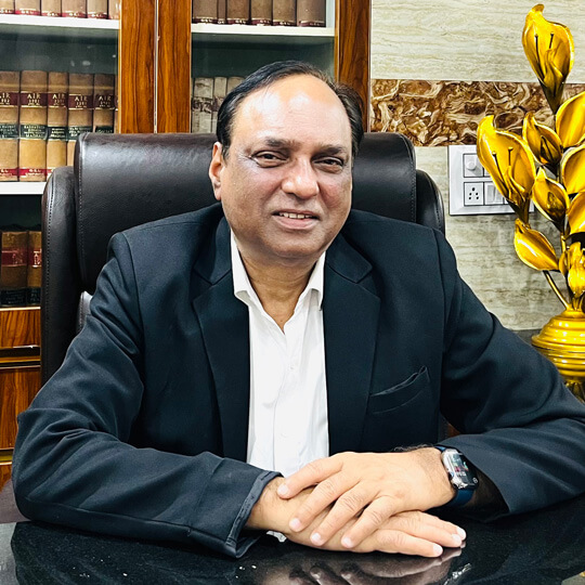 Advocate Dr. Surendar K. Chowdhry in legal attire at office desk
